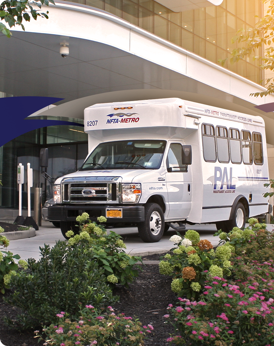 An NFTA paratransit vehicle parked in front of an accessible building entrance